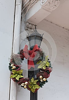 Decorated with a flower wreath old street lamp in casco viejo panama city