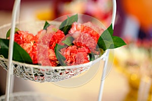 Decorated flowers on white stand in the ceremony or wedding day