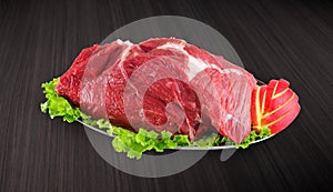Decorated fresh raw meat - ham with vegetables with clipping pat