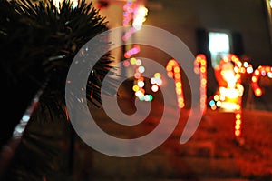 Decorated a front house with color lights, red, green and white.