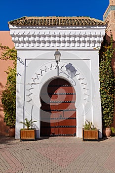 Decorated gate with massive wooden door