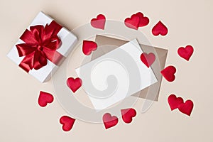 Decorated gift box and letter with red ribbon and hearts