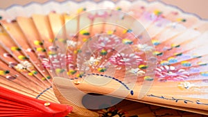 Decorated hand fan in rotation