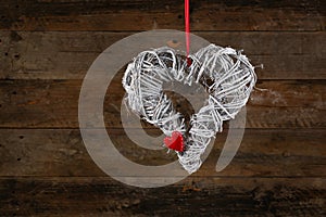 Decorated Heart Shape Christmas Wreath White Twigs Gingham Ribbon Red Heart on Old Rustic Background