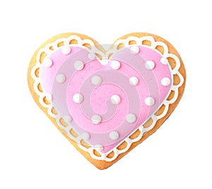 Decorated heart shaped cookie on white background