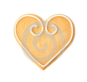 Decorated heart shaped cookie on white background