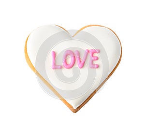 Decorated heart shaped cookie with word LOVE on white background, top view.