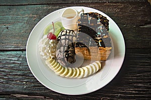 Decorated Honey and chocolate lava on Toast with vanilla ice cream and banana and whipped cream