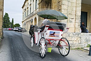 Decorated horse carriage that offer a unique tour around Corfu town