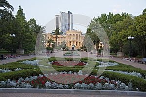 Decorated lawns in garden with pines