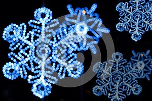 Decorated led of Christmas blue lighting in snowflake shape on night time and black background