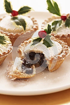 Decorated mince pies on plate close-up