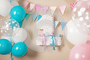 Decorated number 1 for a birthday. Happy birthday one year for twins. White, pink, blue colors