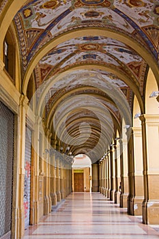 Decorated old portico with columns in Bologna