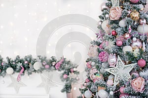 Decorated in a pink Christmas tree on a blurred, sparkling and fabulous background.