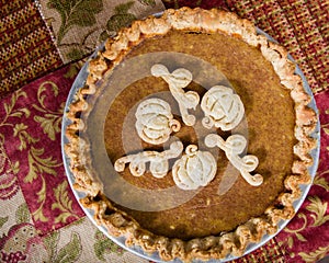 Decorated pumpkin pie with dough