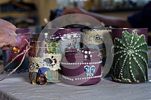 Decorated recycled jars and tins.  Crafting