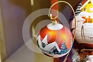 Decorated red Christmas ball. Christmas decorations. Out of focus background