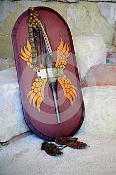 Decorated Roman scutum shield, studded belt and leather sandals