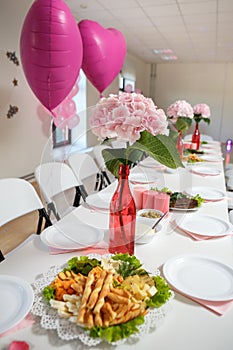 Decorated served party table in pink pastel color