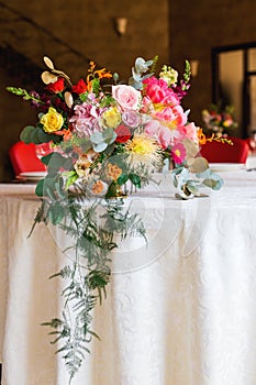 Decorated table, vases of flowers. Close up. Wedding concept