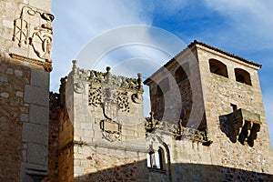 Decorated top of the medieval palace Golfines de Abuja in Caceres, Spain. Nowadays, city hall