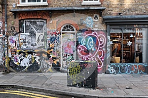 A decorated wall and a lovely funky graffiti, Shoreditch, Uk