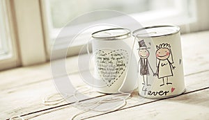 Decorated wedding cans with threads