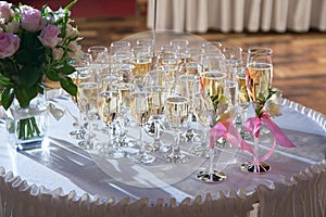 Decorated wedding glasses with champagne