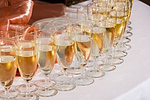 Decorated wedding glasses with champagne