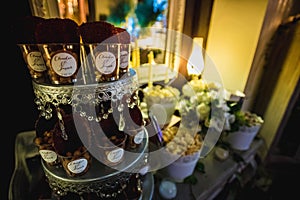 Decorated wedding table with candy bar photo