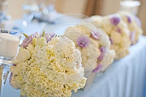 Decorated wedding table with flowers and candles