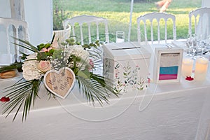 Decorated wedding table with text french urn vive les maries means long live the bride and groom and sand box marked together photo