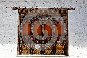 Decorated window in the facade of Punakha Dzong monastery in Punakha, Bhutan