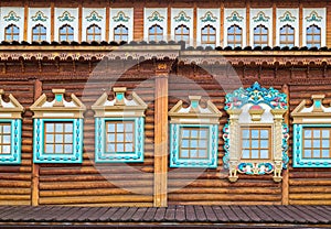 Decorated windows in old wooden house