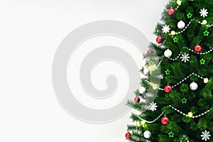 Decorated xmas tree isolated on white, right side closeup