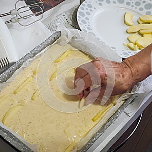 Decorating the cake with apple