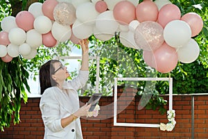 Decorating the garden with balloons for a party, ceremony