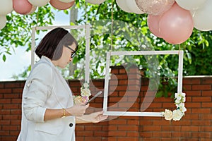 Decorating the garden with balloons for a party, ceremony