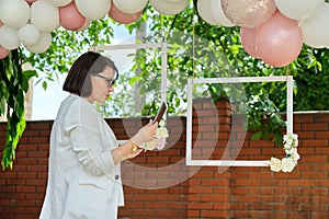 Decorating the garden with balloons for a party, ceremony