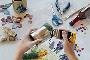 Decorating a tin can. Creation