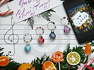 Decoration balls are arranged on the paper like music notes