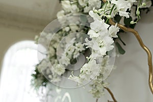 Decoration of the banquet hall, photo zone and wedding arch with eucalyptus leaves, hydrangea and eustoma in the wedding hall.