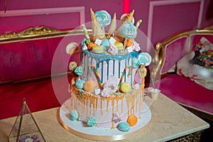 Decoration for cake and bekery. Colorfull cake pops in waffle cone for ice cream in assortment, decorated with confectionery