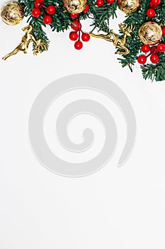 Decoration christmas concept, Fir tree branches decorating with red berries and gold ball with deer
