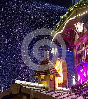 Decoration of Christmas market booths with snow.