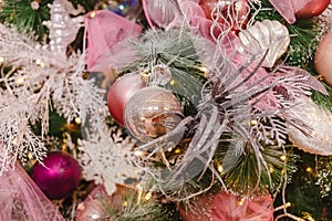 Decoration of the Christmas tree with pink and white balls