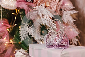 Decoration of the Christmas tree with pink and white balls