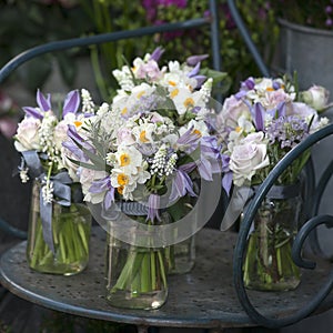 Decoration of dining table. bouquet of white narcissus in vase o