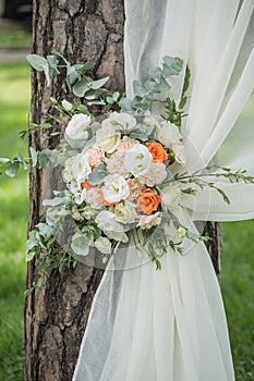 Decoration of flowers and fabrics of a wedding arch